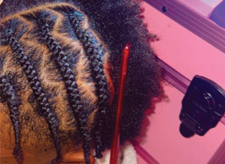 Freshly installed cornrows in clean straight-back rows